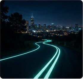 A glowing pathway overlooking a city at night